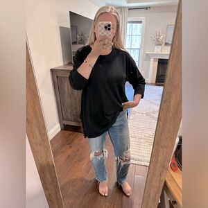 Cable and gauge ruffle split hem knit blouse